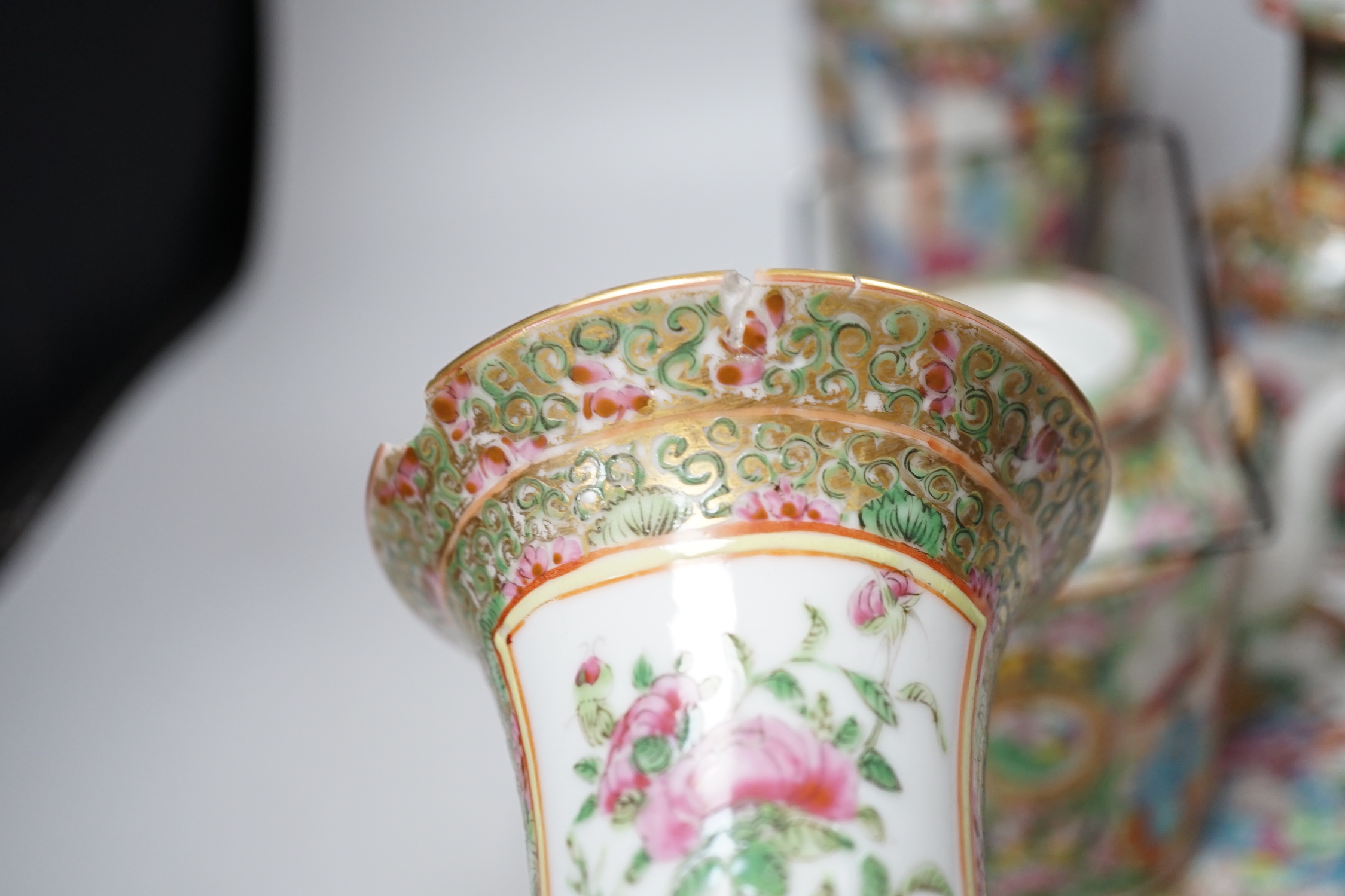 A collection of Chinese Cantonese famille rose vases, two teapots and a plate